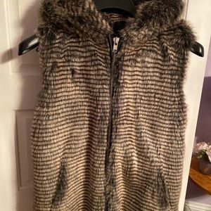 Very cool faux fur hooded vest. Good in 3 seasons. Layer it over anything.